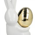 Floristik24 Veľkonočné zajačiky elegantné, keramické zajačiky so zlatým vajíčkom, veľkonočná dekorácia biela, zlatá V18cm 2ks